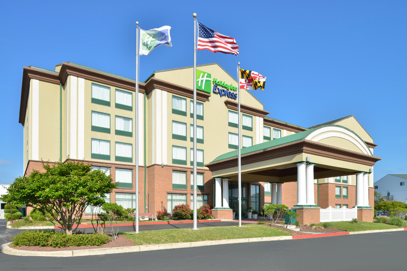 a picture of the Holiday Inn Express & Suites in Ocean City, MD showing the exterior of the building