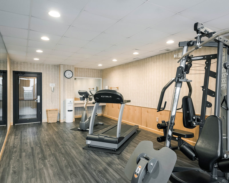 a picture of the fitness center at the comfort inn gold coast in ocean city, md