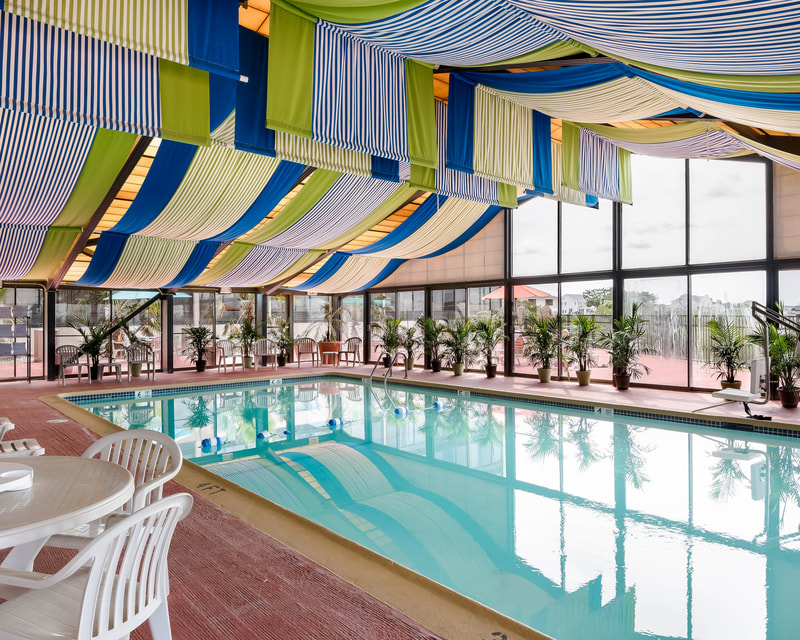 a picture of the indoor pool area at the comfort inn gold coast in ocean city, md